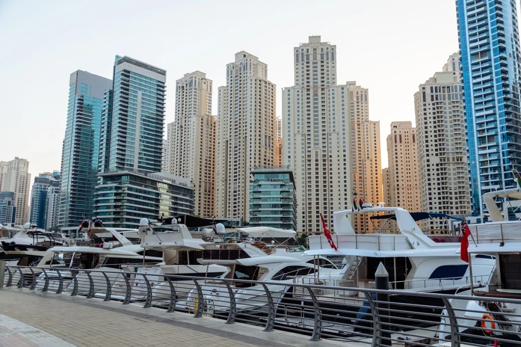 Yacht Rental Dubai Marina: Best Operators, Routes & Booking from JBR/Palm (2026) 1 Travel to Dubai - Yacht Rental Dubai Marina: Best Operators, Routes & Booking from JBR/Palm (2026) - Photo: Dubai Marina bay with residential neighborhood