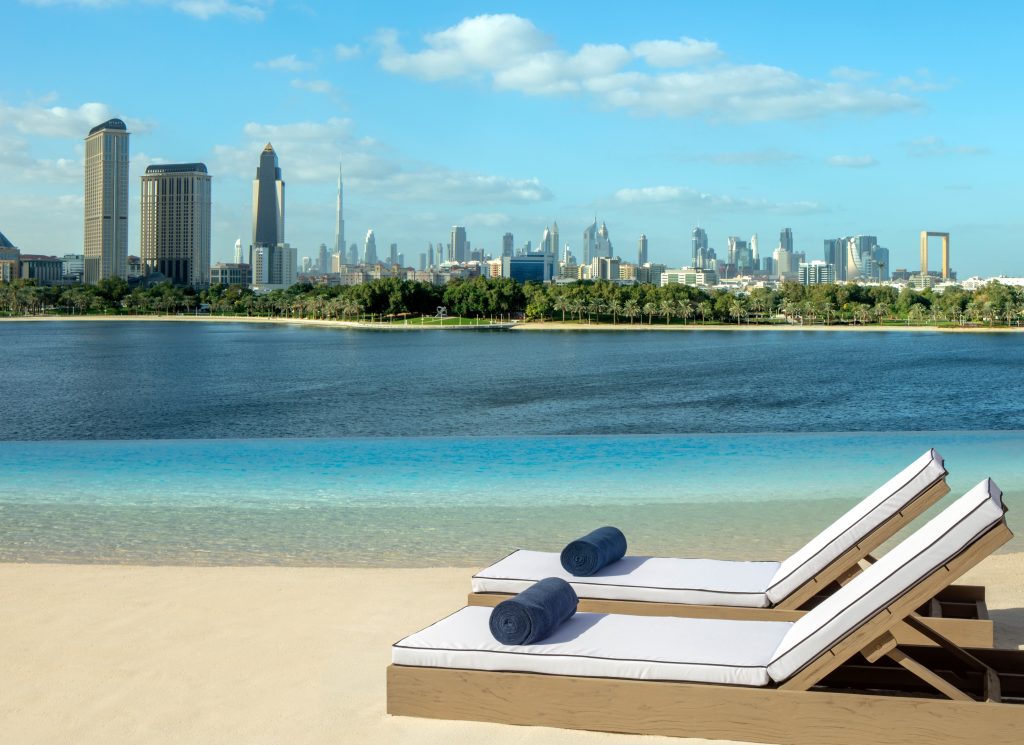 Lounge chairs by serene lagoon view