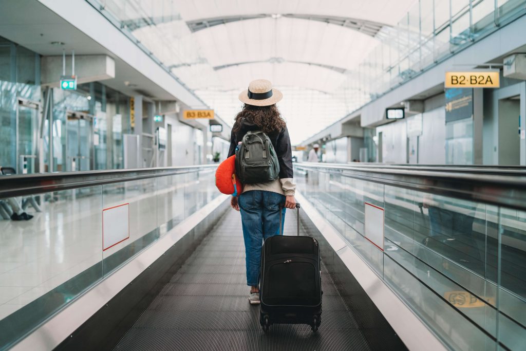 Flying Out of Thailand Airports? Passenger Service Charge to Rise From 20 June 2026 2 Travel to Dubai - Flying Out of Thailand Airports? Passenger Service Charge to Rise From 20 June 2026 - Photo: Young woman at the airport with a suitcase.jpg 1