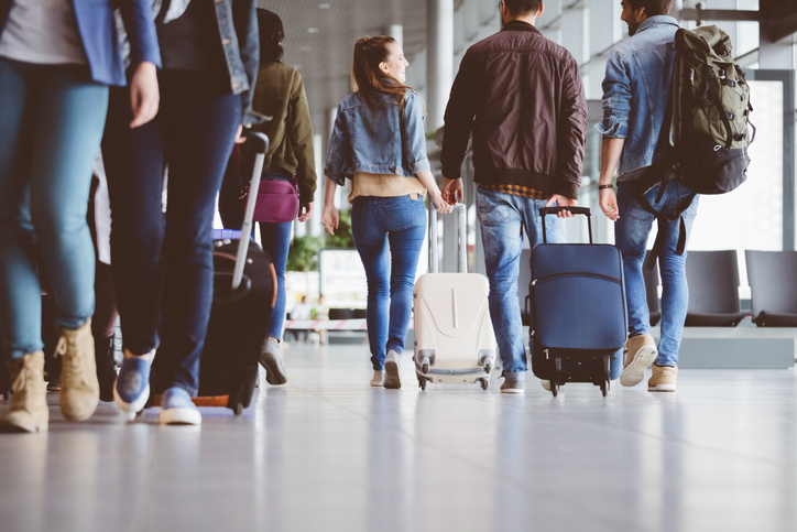 Ebola Outbreak 2026: What UAE Residents Planning Summer Travel Need to Know Before Flying 1 Travel to Dubai - Ebola Outbreak 2026: What UAE Residents Planning Summer Travel Need to Know Before Flying - Photo: Passengers walking in the airport corridor stock photo.jpg