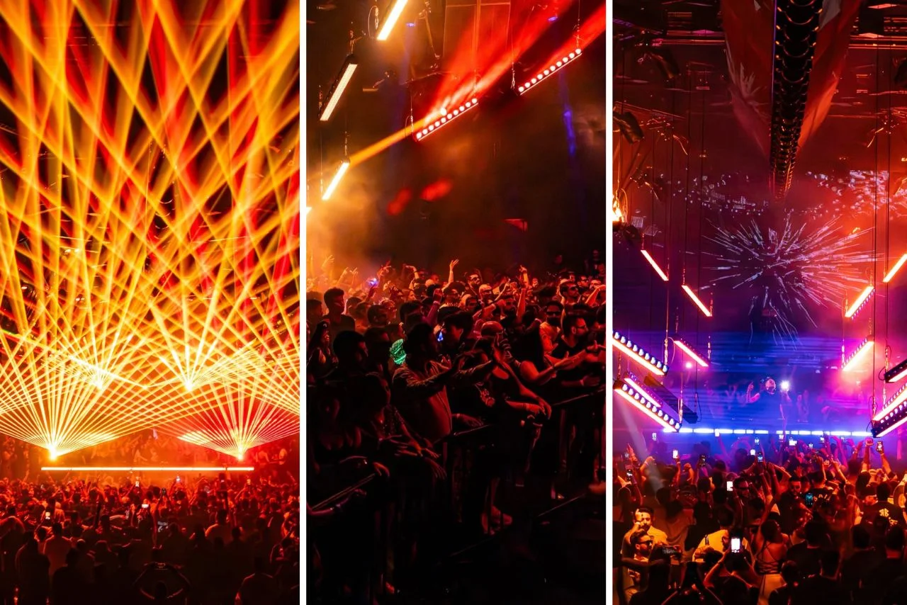 A vibrant nightclub scene with colorful laser lights and a lively crowd. Energetic atmosphere, with people dancing amid intense orange and red lighting.