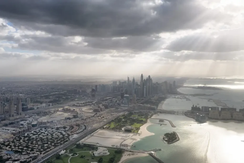 Travel to Dubai - Dubai Weather Guide: Best Months to Enjoy Beaches, Desert Safaris & Festivals  - Photo: aerial city skyline from helicopter dubai 2026 03 26 06 27 18 utc 1 1